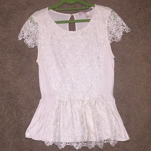 Cream peplum with lace detail